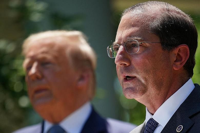 US Secretary of Health and Human Services Alex Azar (at right) at the White House in Washington with President Donald Trump in May. Mr Azar's planned visit to Taiwan comes at a time when US-China ties are at an all-time low. PHOTO: AGENCE FRANCE-PRES