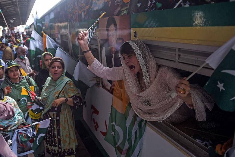 Supporters of Pakistan's ruling Tehreek-e-Insaf party shouting slogans during a protest in Karachi yesterday to show their solidarity with the people of Indian-administered Kashmir. The disputed Himalayan territory has been split since 1947 between I