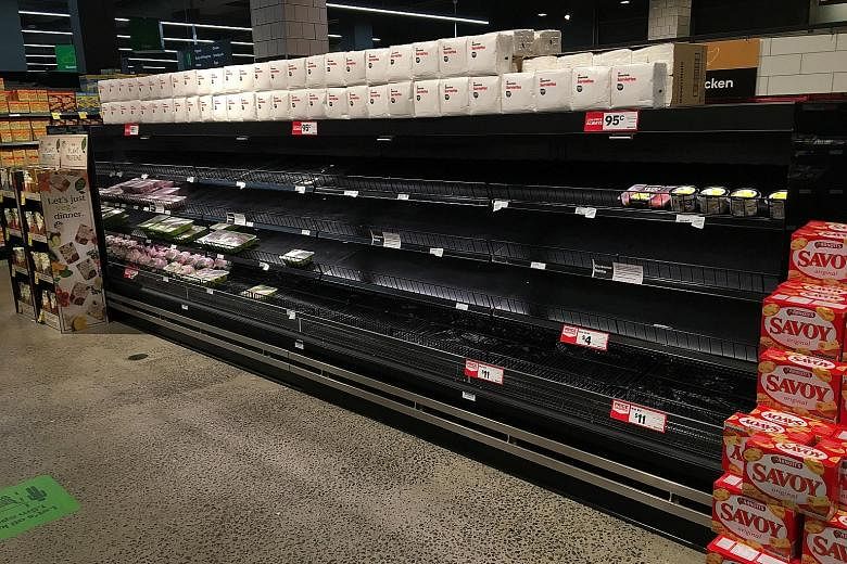 Empty shelves in the poultry section of a Woolworths supermarket in Melbourne, Australia, on Wednesday. The CPTPP says open and connected supply chains play an instrumental role in avoiding food shortages. PHOTO: EPA-EFE