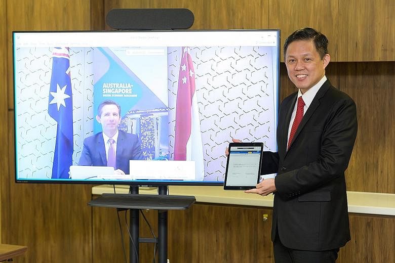 Trade and Industry Minister Chan Chun Sing with his Australian counterpart Simon Birmingham at the virtual event. PHOTO: MINISTRY OF TRADE AND INDUSTRY