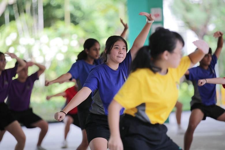 Secondary 2 students from Chua Chu Kang Secondary School taking part in a wushu session on Wednesday. The session is one of the school's enrichment programmes that are conducted in person and at a class level for all Secondary 1 to Secondary 3 classe