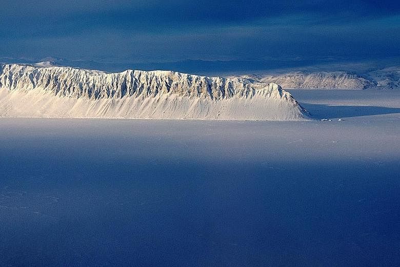 Eureka Sound on Ellesmere Island as seen in a Nasa Operation IceBridge survey picture taken on March 25, 2014. The Milne Ice Shelf, at the fringe of Ellesmere Island, has collapsed. "Above-normal air temperatures, offshore winds and open water in fro