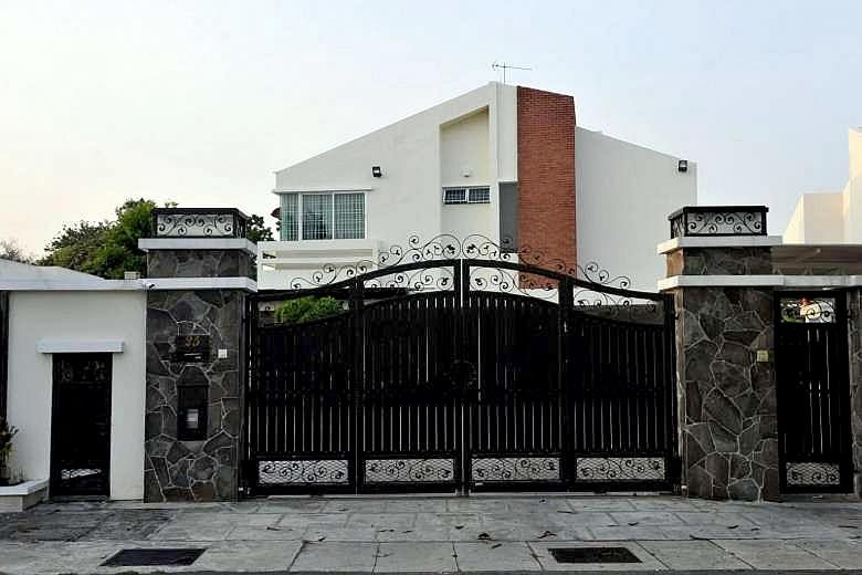 Lim had been charged in 2016 for allegedly receiving gratification by buying a bungalow (above) from businesswoman Phang Li Koon below market value when he was Penang chief minister.