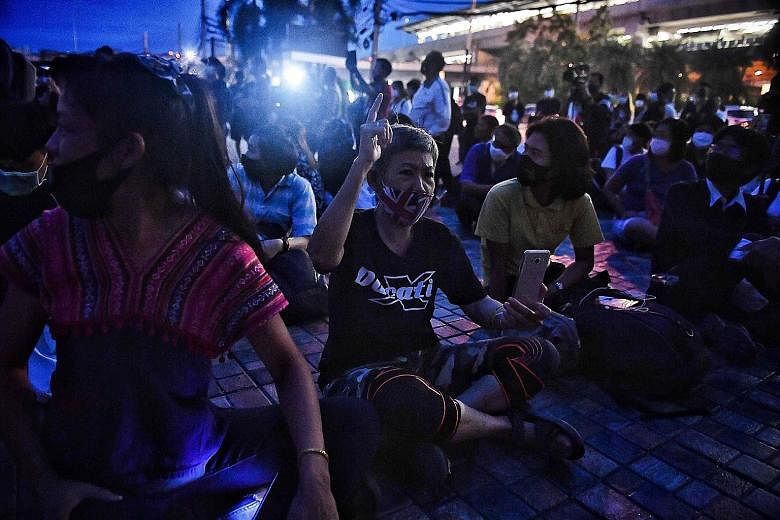 Demonstrators rallying for the release of two Thai activists outside the Bang Khen police station in Bangkok yesterday, after police acted against the movement of young protesters.