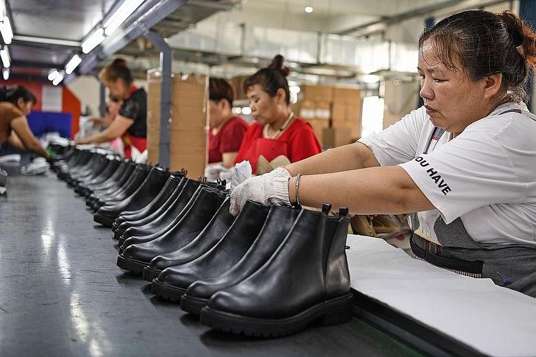 A shoe factory in Huainan, China's eastern Anhui province. Data out yesterday showed China registered a surprise jump in its July exports as the global economy slowly reopened after Covid-19 lockdowns. But analysts cautioned that the road ahead may s