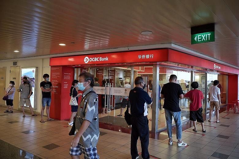 OCBC Bank's earnings since March have been hit by business disruptions and a slowdown in customer activities because of the coronavirus pandemic. Its net interest margin fell to 1.68 for the first six months this year from 1.78 a year ago, and OCBC g