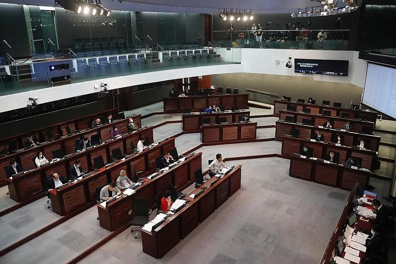 A Legislative Council meeting to debate the national security law in Hong Kong last month. The top decision-making body of China's Parliament convened a four-day session yesterday to discuss whether to extend the term of the current Hong Kong legisla