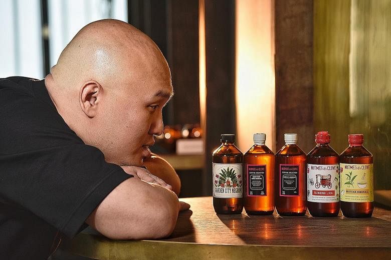 Nutmeg & Clove co-founder Colin Chia with the bar's bottled cocktails, which it has been selling since the start of its business in 2014. ST PHOTO: DESMOND WEE