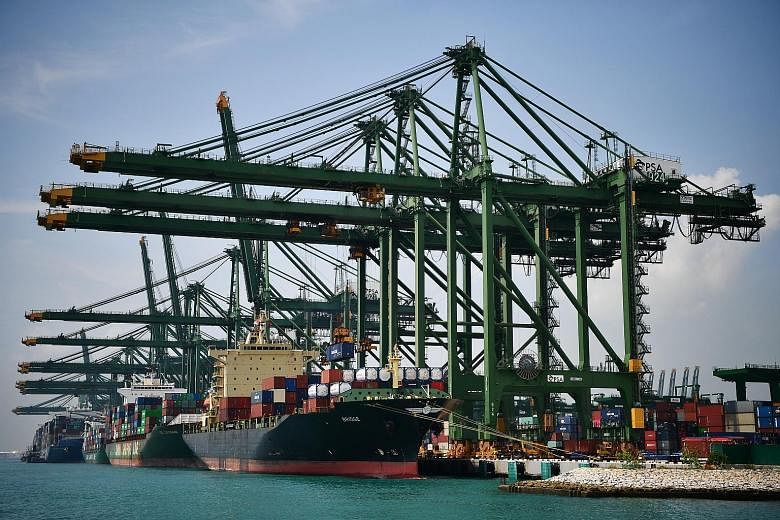 Activity at Pasir Panjang Terminal last October. The total number of vessel arrivals has fallen 39.8 per cent to 6,701 in June from 11,138 a year ago, while container volumes have dropped by 1 per cent in the first six months of this year from a year
