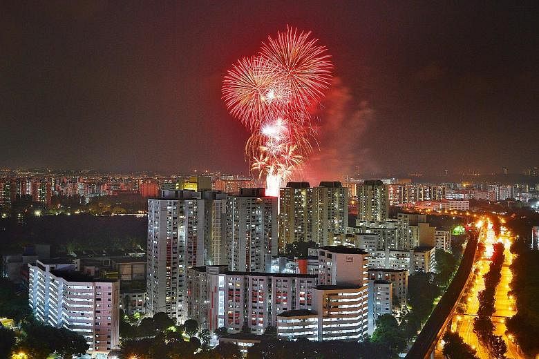The fireworks over Jurong Lake last night, as seen from J Gateway condominium. This year's National Day fireworks were set off at 10 locations as celebrations took place all over Singapore rather than at a central spot.