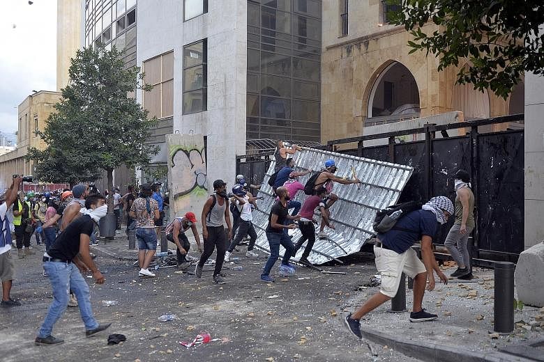Lebanese anti-government protesters giving vent to their anger in an area close to Parliament in Beirut on Sunday. They were demanding an end to corruption, bad governance and mismanagement.