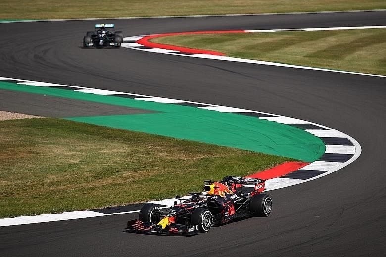 Above: Red Bull's Max Verstappen speeds ahead of Mercedes' Valtteri Bottas before romping to victory at the 70th Anniversary Grand Prix at Silverstone. Below: Six-time world champion Lewis Hamilton of Mercedes was beaten by Verstappen but still leads