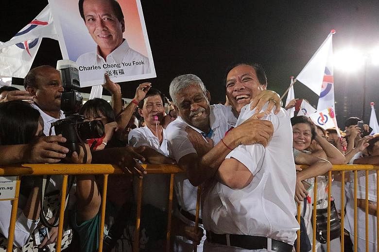 A supporter hugging Mr Chong, then candidate for Punggol East SMC, at Bedok Stadium in 2015. He won with 51.77 per cent of the vote.