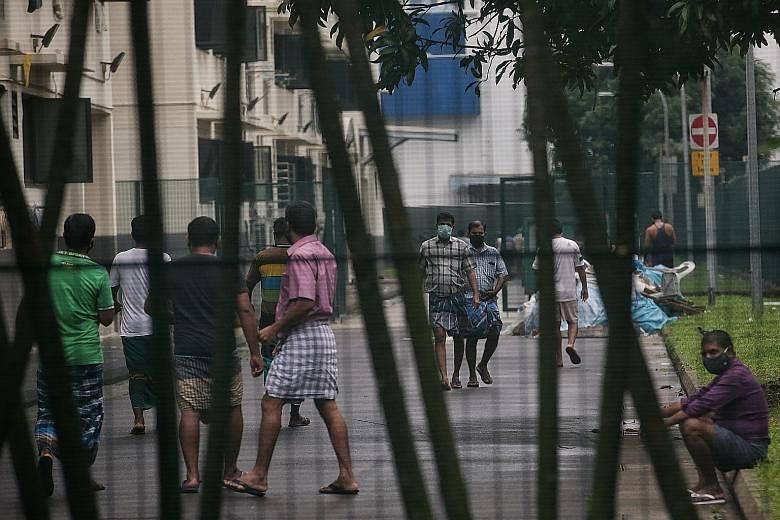 Foreign workers at Kian Teck Hostel at 26 Kian Teck Avenue. The authorities said safeguards have been put in place to ensure the intensive efforts spent on dormitories over the past four months so far do not go to waste. ST PHOTO: KEVIN LIM