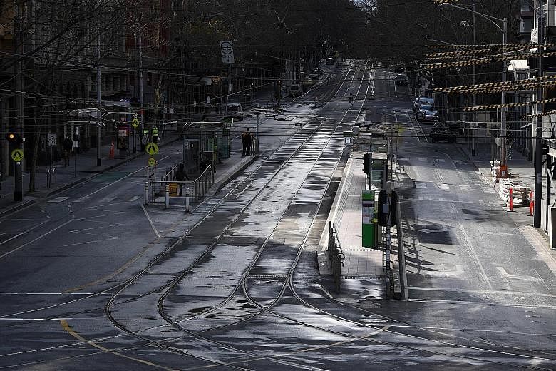 Bourke Street in Melbourne yesterday, amid the six-week lockdown which began on Aug 2 and includes a curfew from 8pm to 5am and the closure of schools and all non-essential shops. PHOTO: EPA-EFE
