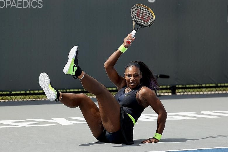 Former world No. 1 Serena Williams falls after a forehand during her opening match against American compatriot Bernarda Pera at the Top Seed Open in Kentucky. The top seed recovered to win 4-6, 6-4, 6-1.