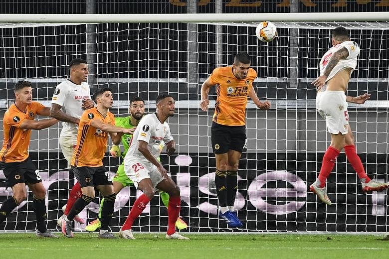 Lucas Ocampos heading in the only goal of the game against Wolves for five-time Europa League champions Sevilla to reach the semi-finals, where they will meet Manchester United on Sunday.