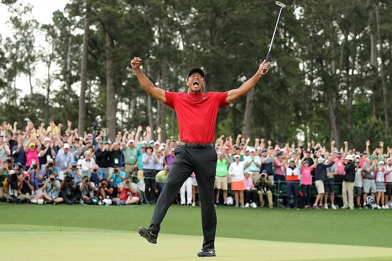 Huge crowds were on hand to cheer Tiger Woods as he celebrated last year's Masters win. Fans will be barred from this year's delayed edition in November due to Covid-19.