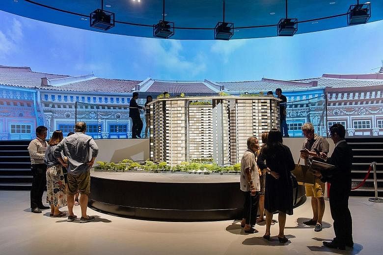 An architectural model of City Developments' 592-unit Amber Park at the sales gallery. With the circuit breaker affecting Singapore residential sales in the first half, CDL said the group and joint venture associates sold 356 units totalling $514.7 m