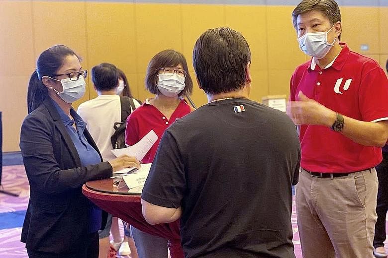 NTUC secretary-general Ng Chee Meng (right) visiting Resorts World Sentosa staff amid a retrenchment exercise last month. In an interview on Thursday, Mr Ng noted that the overall level of anxiety among Singaporeans over foreigners working here has h