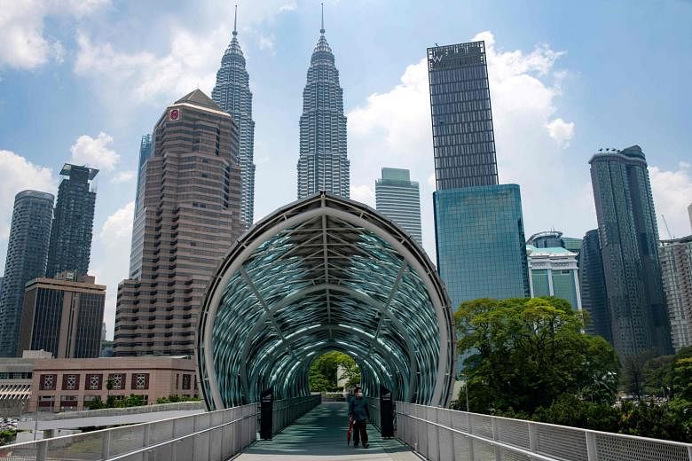 Malaysia's second-quarter GDP decline reflects the "unprecedented impact of the stringent containment measures to control the Covid-19 pandemic", said Bank Negara. PHOTO: AGENCE FRANCE-PRESSE