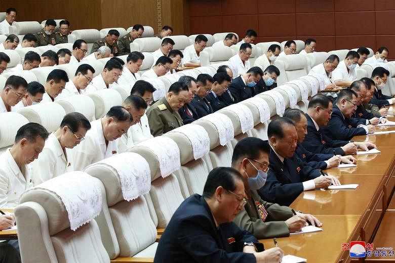 Members of the Presidium and Political Bureau of the Central Committee of the Workers' Party at a meeting in Pyongyang on Thursday. North Korea has been hit by flooding, but leader Kim Jong Un said the country should not accept foreign aid because of