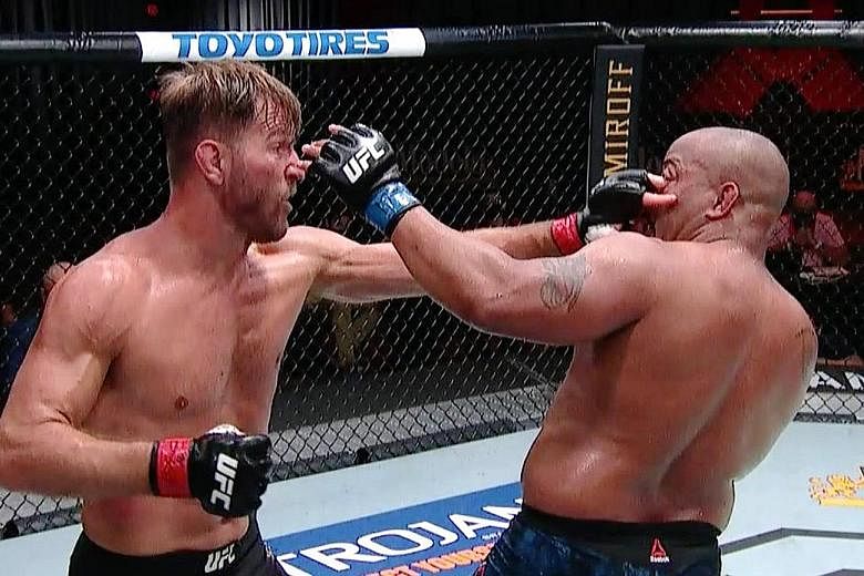 Stipe Miocic poking Daniel Cormier in the eye in the third round of the main fight of UFC 252 in Las Vegas on Saturday. The former Ultimate Fighting Championship (UFC) light heavyweight and heavyweight champion confirmed that he was retiring at age 4