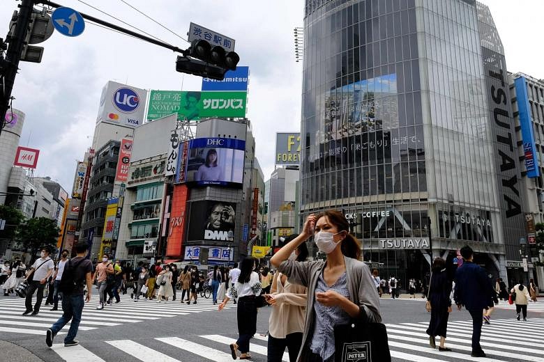 Japan's economy shrinks at record 27.8% as Covid-19 pandemic hits ...