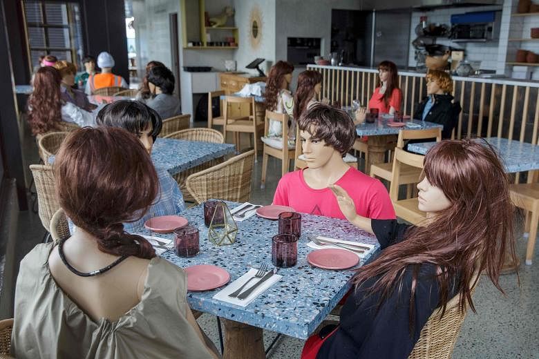 A cafe forced to close in Auckland leaves mannequins at the tables to mimic customers. Yesterday's numbers bring New Zealand's total active cases to 69, providing more ammunition to a conservative opposition that wants to delay the Sept 19 general el