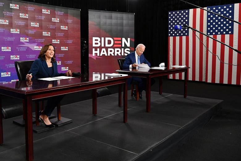 Mr Joe Biden and his running mate Kamala Harris signing documents required for receiving the Democratic nomination for president and vice-president in Wilmington, Delaware, last Friday. The duo are from the centre of the Democratic Party, making them