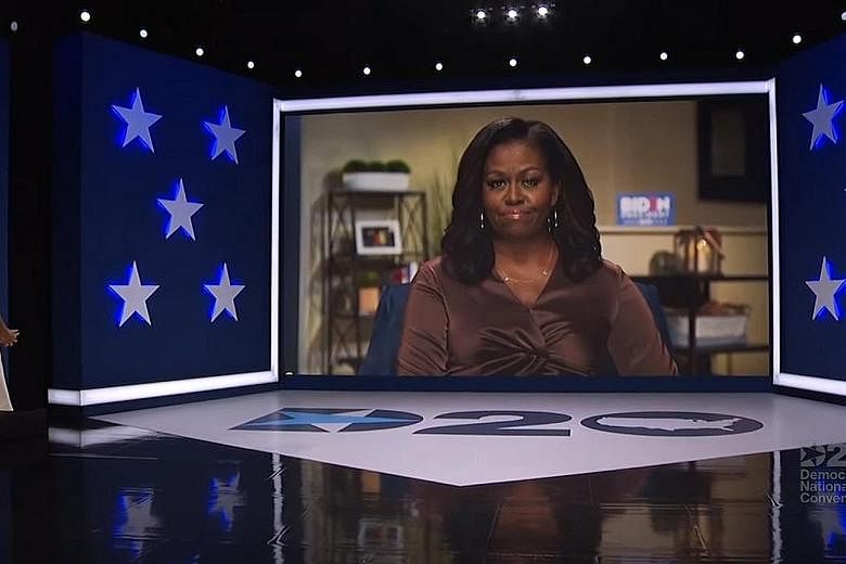 Former first lady Michelle Obama, who was introduced by host Eva Longoria, on screen during the Democratic National Convention that was broadcast from Milwaukee, Wisconsin, on Monday. Mrs Obama said Mr Joe Biden's steady and empathetic approach to pr