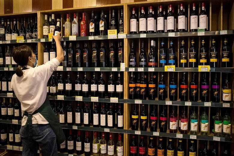 Australian wine seen among others in a Beijing store. The latest anti-dumping probe will likely worsen tensions with Australia. PHOTO: AGENCE FRANCE-PRESSE