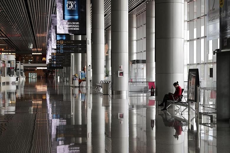The departure hall at Changi Airport's Terminal 4 on May 12, during the circuit breaker period to stop the spread of the coronavirus. With most planes still grounded, Singapore's aviation sector has been hard hit, with not only airlines affected but 