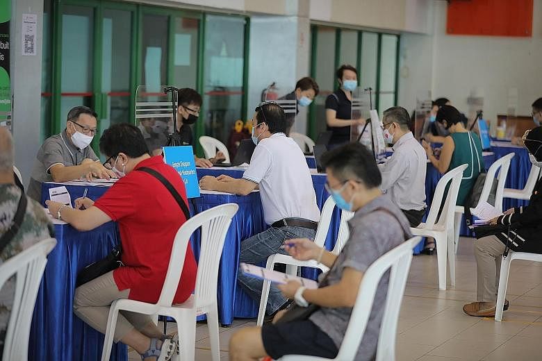 Job seekers at a job fair at Chong Pang Community Club yesterday, which drew some 160 Singaporeans. The fair offered job seekers career advice and on-the-spot interviews with potential employers.