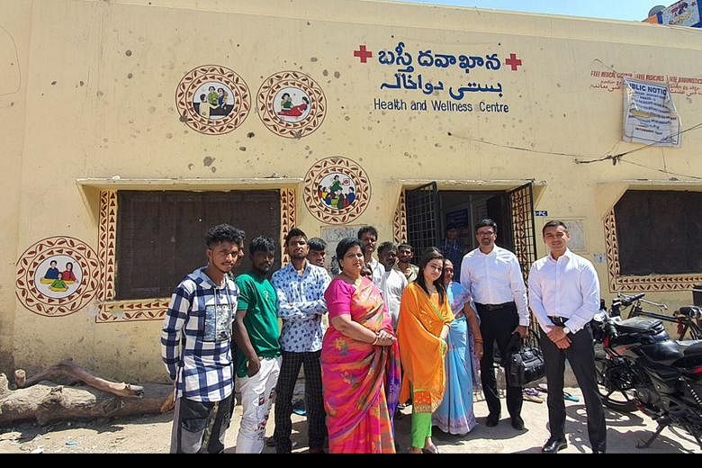 The writer (far right) with Dr Rajesh Dash (beside him) - with whom he is working in the Global Health Impact Partnership - and community members earlier this year at a Basti Dawakhana clinic, a low-cost primary care clinic, as part of a collaboratio