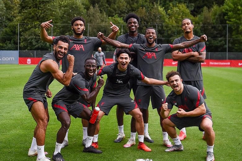 SWEET TWEET Liverpool's Gini Wijnaldum asks fans to "caption this" as the Reds take a break during their pre-season training camp.