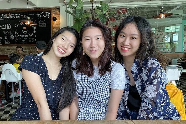 Ms Rachel Han (left) and Ms Rachel Lee (right) are founders of Package Pals, an initiative that collects single-use packaging and distributes it to retailers for reuse. With them is core team member Puan Xin.