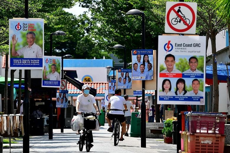 People's Action Party and Workers' Party campaign posters in New Upper Changi Road in East Coast GRC before the July 10 general election. Analysts reckon that it is too soon to say if anything has fundamentally changed about the way voters approach t