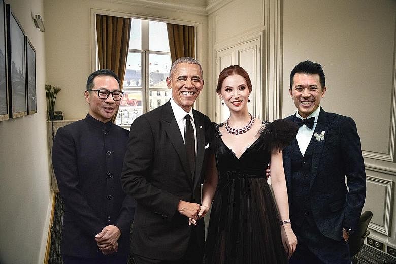 Above: A publicity picture distributed by Bellagraph Nova Group that purports to show owners Terence Loh (from left), Evangeline Shen and Nelson Loh meeting former United States president Barack Obama at a private meeting in Paris. Right: In reality,