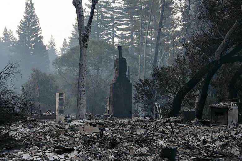 The remains of a residence damaged by the LNU Lightning Complex Fire in Healdsburg on Saturday. President Donald Trump has declared the fires to be a major disaster. The President's declaration allows federal funds to be used to help people and busin