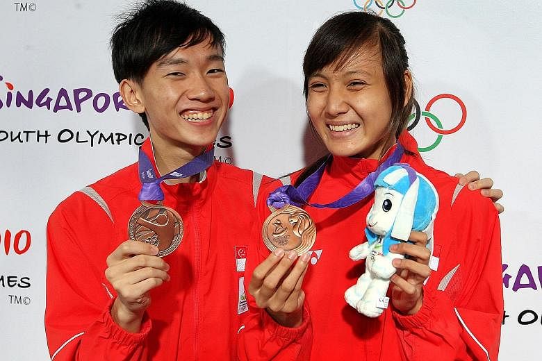 Taekwondo exponents Daryl Tan and Shafinas Abdul Rahman, who each won a bronze in the 55kg category of the 2010 Youth Olympics, are no longer active in the sport. ST FILE PHOTO