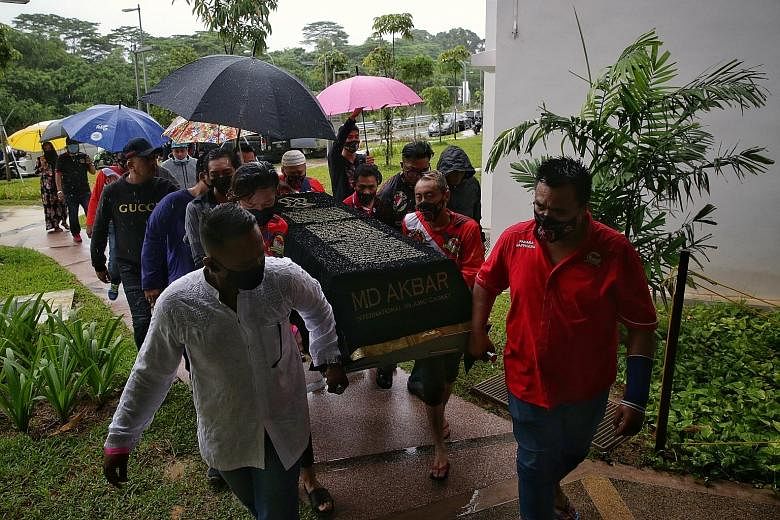 Friends and relatives carrying the body of Putera Muhammad Indra Shazrine Suzaini to his family in Yishun yesterday. Rescue divers had found the teenager 15m from the shore at Changi Beach Park last Saturday. He was later pronounced dead at the scene