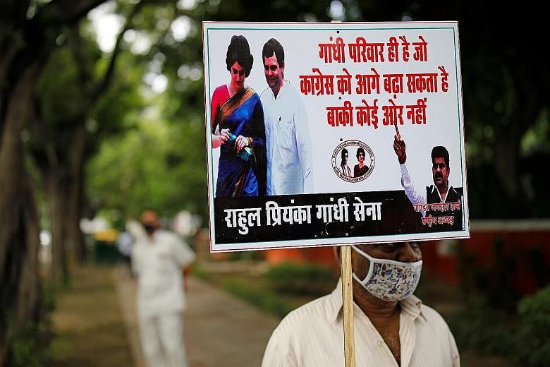 A protester at a rally to demand that the Congress party elect its leader from the Nehru-Gandhi family, outside the party's headquarters in New Delhi yesterday. Congress' interim president Sonia Gandhi had wanted to step down following the release of