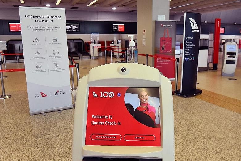 An empty Qantas departure terminal at Melbourne Airport last week. The airline is bracing itself for a A$10 billion (S$9.8 billion) revenue hit in this financial year due to the coronavirus pandemic.