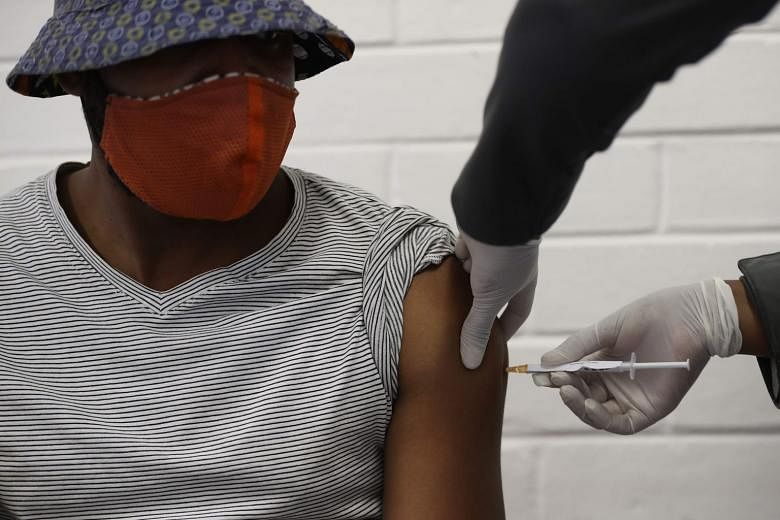 One of the first South African trialists in the AstraZeneca-University of Oxford's clinical trial being injected with a potential vaccine against the coronavirus at the Baragwanath hospital in Soweto, South Africa, in June. PHOTO: AGENCE FRANCE-PRESS