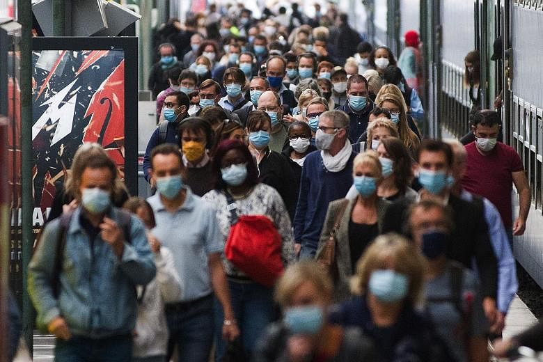 Commuters at Gare Du Nord railway station in Paris yesterday. Europe's tourism industry reopened last month, and prime tourist destinations like France, Spain and Malta have recently reported higher Covid-19 infection rates than countries like Britai
