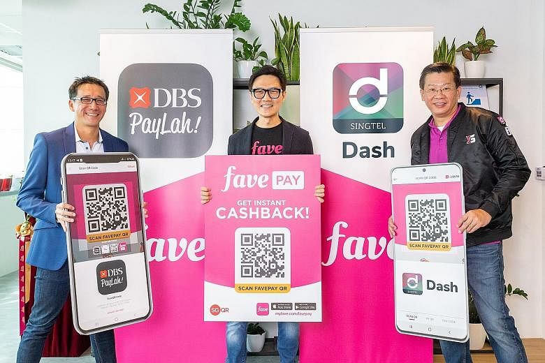 (From far left) Mr Edward Yue, head of DBS PayLah!, Mr Ng Aik-Phong, regional managing director of Fave Singapore and Malaysia, and Mr Gilbert Chuah, head of mobile financial services at Singtel's International Group, at yesterday's event to announce