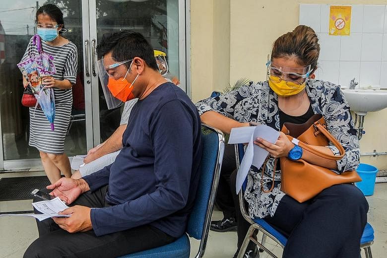 People waiting to take a Covid-19 swab test in Medan, Indonesia, yesterday. Noting that men account for about 60 per cent of deaths from Covid-19 globally, a new study examined the differences in male and female immune responses.