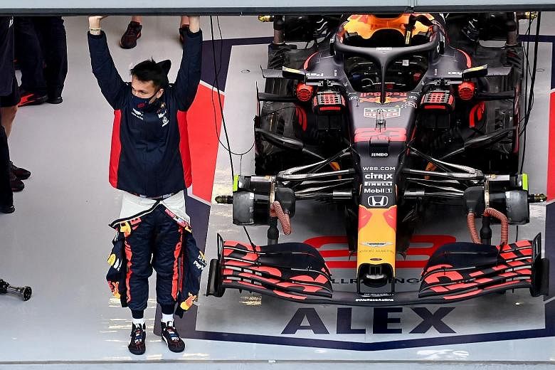 Red Bull's Alexander Albon in his garage during the July 10-12 Steiermark Grand Prix in Austria where he finished fourth, tying for the best result of his Formula One career. PHOTO: AGENCE FRANCE-PRESSE