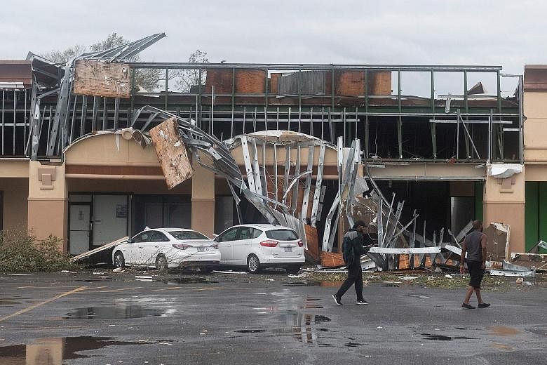 A damaged building in Lake Charles, Louisiana, after Hurricane Laura tore through the area yesterday. The city of 78,000 was seeing sustained winds of 137kmh and gusts of up to 206kmh in the hour after landfall, said the National Hurricane Centre. Ab